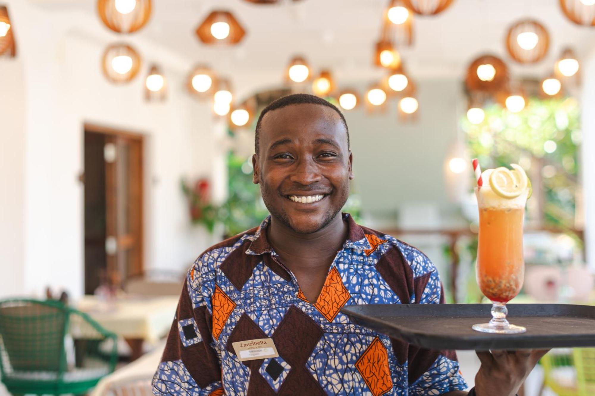 Zanzibella Hotel & Spa Kiwengwa  Εξωτερικό φωτογραφία A waiter at the Serena Hotel in Kampala, Uganda