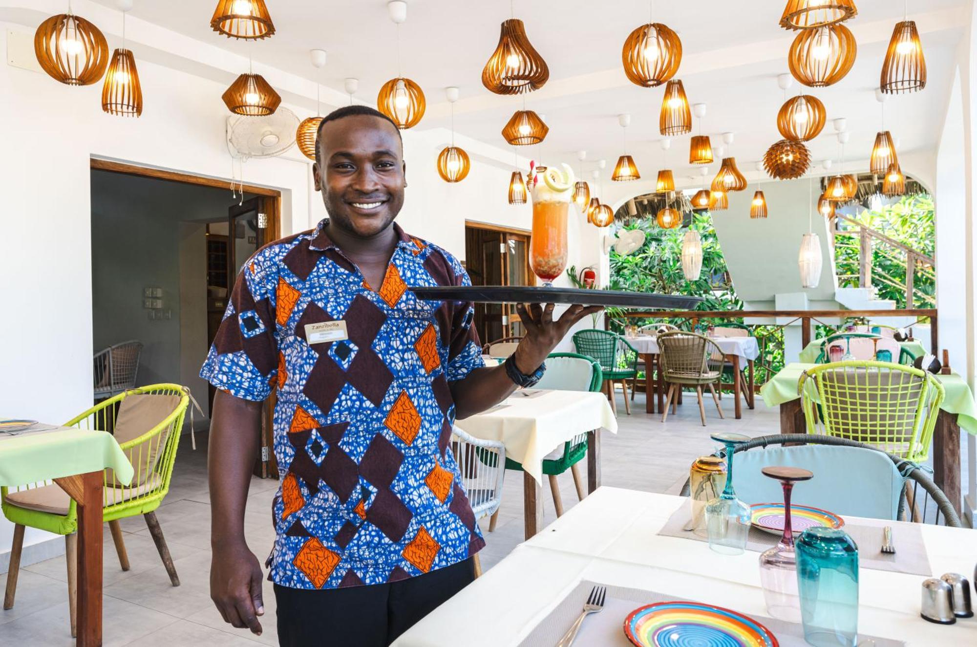 Zanzibella Hotel & Spa Kiwengwa  Εξωτερικό φωτογραφία A waiter at a restaurant in Ghana